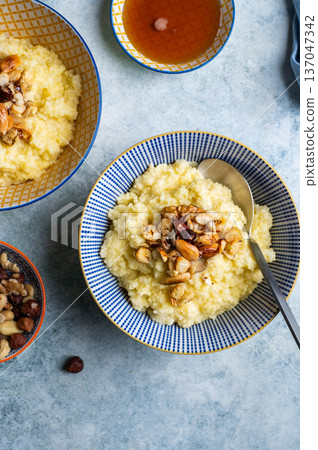 Millet porridge with mixed nuts 137047342