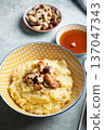 Millet porridge with mixed nuts 137047343