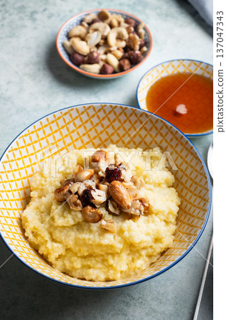 Millet porridge with mixed nuts Millet porridge with mixed nuts 137047343