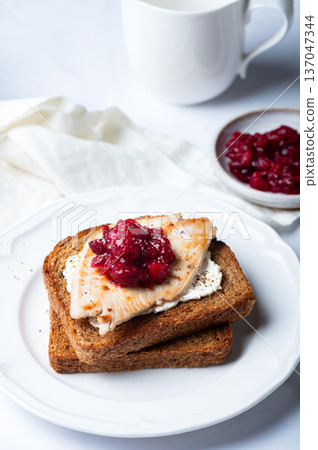 Open sandwich from leftover turkey and cranberry sauce Open sandwich from leftover turkey and cranberry sauce 137047344