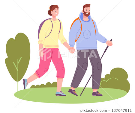 Couple hiking together. Summer nature outdoor activity Couple hiking together. Summer nature outdoor activity 137047911