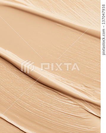 Creamy cosmetic smear in macro style on neutral cappuccino backdrop showing skincare texture with smooth detail concept 137047938