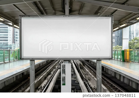 Blank billboard at the station, perfect for mock-up and advertising design. Urban setting with modern transportation and city life in the background Blank billboard at the station, perfect for mock-up and advertising design. Urban setting with modern transportation and city life in the background 137048811