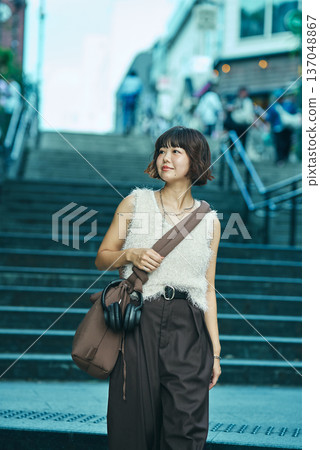 A young woman walking 137048867