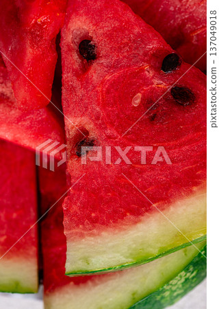 Fresh juicy sliced watermelon close up Fresh juicy sliced watermelon close up 137049018