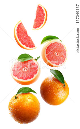 Fresh whole and sliced grapefruits with green leaves and water drops on white background, citrus freshness and fruit pattern 137049187