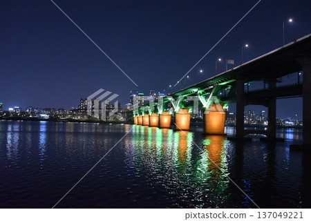 Night city bridge with colorful reflection on river Night city bridge with colorful reflection on river 137049221