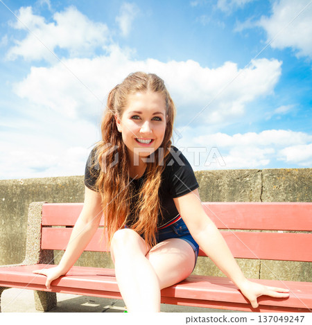 Happy teenager woman outside. Happy teenager woman outside. 137049247