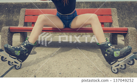 Sexy woman wearing roller skates Sexy woman wearing roller skates 137049252