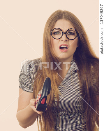 Dissatisfied woman after loosing video game Dissatisfied woman after loosing video game 137049267