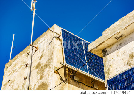 House wall with solar photovoltaic panels. 137049495
