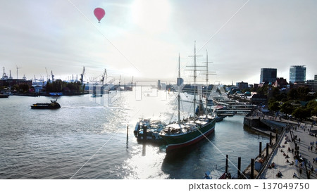 Some very big sailboat  anchored next to Norderelbe riverbank 137049750