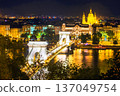 Illuminated  Chain Bridge Szechenyi  and Saint Istvan Basilica   and Danube  in night in Budapest 137049754