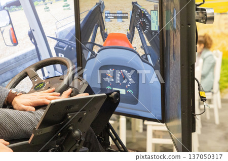 Tractor simulator with user operating controls and digital display screen 137050317