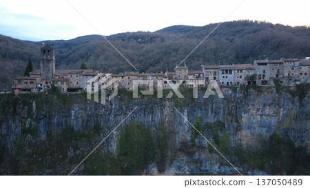 Castellfollit de la Roca on Basalt Cliff in Catalonia Castellfollit de la Roca on Basalt Cliff in Catalonia 137050489