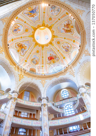 The Frauenkirche in Dresden shows its beautiful dome and detailed artwork. Visitors admire the interior of this historic church, a symbol of Dresden's culture and history. The Frauenkirche in Dresden shows its beautiful dome and detailed artwork. Visitors admire the interior of this historic church, a symbol of Dresden's culture and history. 137050770