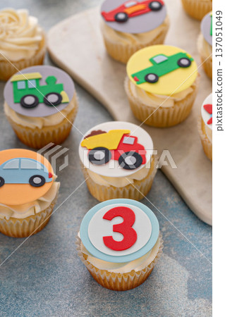 Cupcakes for a boy birthday for three years old with trucks and transport theme 137051049