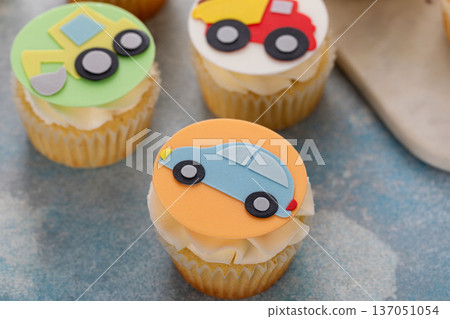 Cupcakes for a boy birthday or a baby shower with trucks and transport theme 137051054
