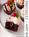Raspberry chocolate cupcakes with fresh raspberries and chocolate sauce 137051066