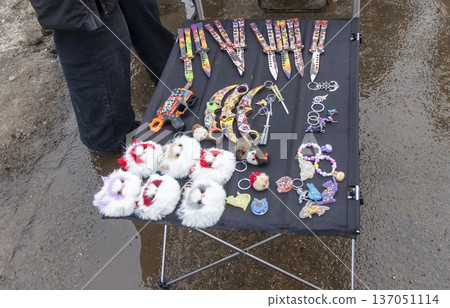 A collection of collectible and novelty items for sale, likely at a flea market. 137051114