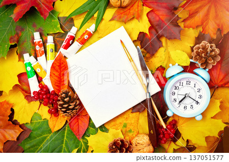 Autumn background of yellow and colored leaves, cones and nuts. place for text. Autumn background of yellow and colored leaves, cones and nuts. place for text. 137051577