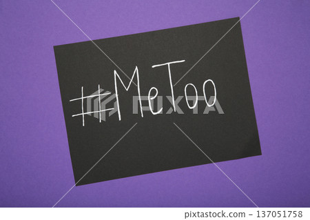 Hashtag METOO inscription white pen on black on violet background 137051758