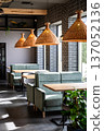 Modern cafe interior with cozy booths and rattan pendant lights in daylight 137052136