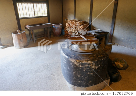 A hearth and mortar in an old Japanese kitchen set up in the dirt floor A hearth and mortar in an old Japanese kitchen set up in the dirt floor 137052709