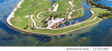 Waterfront golf course in Florida. Sports grounds with green grass in Boca Grande, small town on Gasparilla Island Waterfront golf course in Florida. Sports grounds with green grass in Boca Grande, small town on Gasparilla Island 137052997