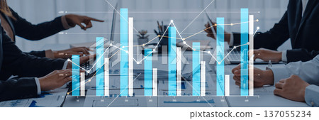 Business Team Analyzing Financial Data with Graphs and Charts in a Modern Office Setting During a Collaborative Meeting Scalp 137055234