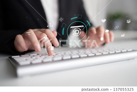 Business Professional Using Computer Keyboard with Digital Graphics and Technology Interface for Modern Work Environment Quark 137055325