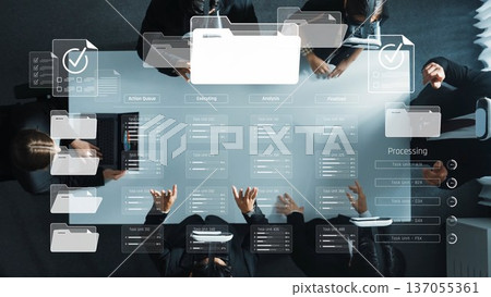 Collaborative Business Meeting with Digital Project Management Interface and Analyzing Data on a Conference Table from Above Perspective. Raster 137055361