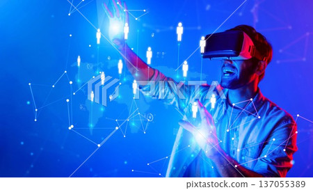 Engaged Young Man Interacting with Virtual Reality in a Colorful Digital Space Surrounded by Abstract Human Figures and Connections. Raster Engaged Young Man Interacting with Virtual Reality in a Colorful Digital Space Surrounded by Abstract Human Figures and Connections. Raster 137055389