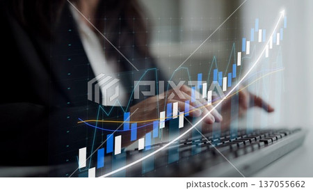 Business Analyst Working on Keyboard with Graphs and Charts in Background Showing Financial Growth and Market Trends for Professional Use Copula 137055662