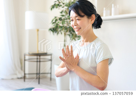Woman enjoying yoga at home 137057059