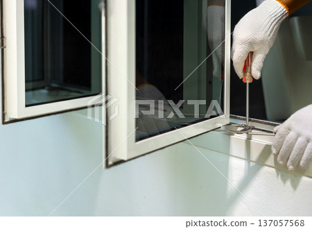 Handyman replace casement window stay friction. 137057568