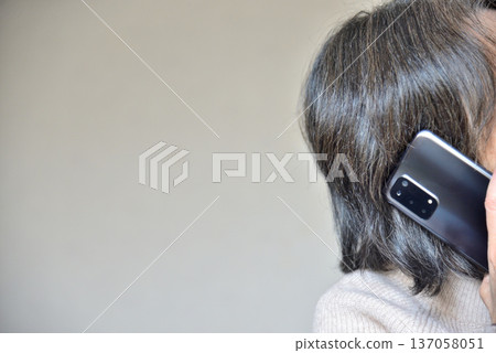 Senior woman talking on a mobile phone 137058051