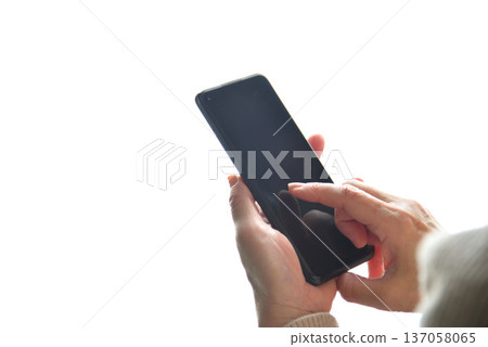 Senior woman operating mobile phone Senior woman operating mobile phone 137058065