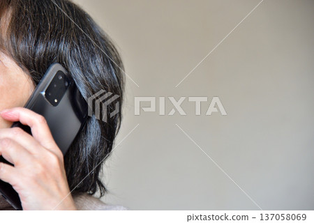 Senior woman talking on a mobile phone Senior woman talking on a mobile phone 137058069
