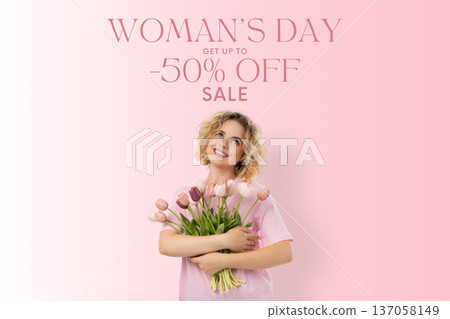 A woman holds flowers while smiling on Women's Day A woman holds flowers while smiling on Women's Day 137058149
