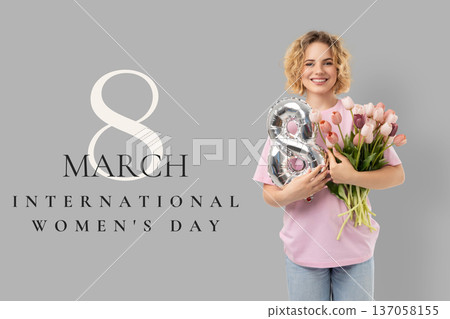 A woman holds flowers and a balloon while celebrating A woman holds flowers and a balloon while celebrating 137058155