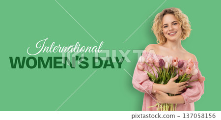 Woman holds flowers and smiles for International Women's Day Woman holds flowers and smiles for International Women's Day 137058156