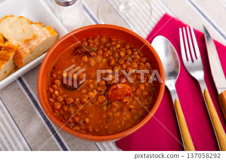 Stewed lentils with sausages, spanish Riojan lentils Stewed lentils with sausages, spanish Riojan lentils 137058292