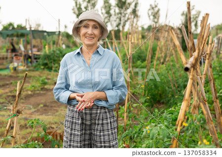 Mature woman at kitchen-garden 137058334