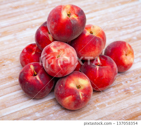 Juicy ripe peaches on wooden table Juicy ripe peaches on wooden table 137058354