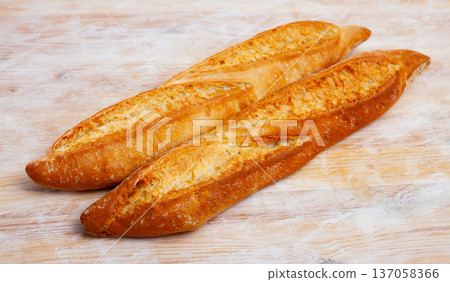 Baguette on wooden surface 137058366
