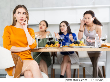 Group of girlfriends at party scold their friend. Quarrel at bachelorette party Group of girlfriends at party scold their friend. Quarrel at bachelorette party 137058490