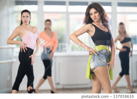 Adult woman dancing high heels in group 137058610