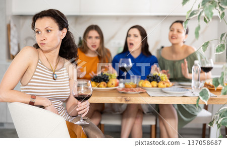 Female friends during family quarrel accuse Caucasian woman Female friends during family quarrel accuse Caucasian woman 137058687