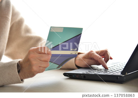Seniors checking their savings passbook Seniors checking their savings passbook 137058863